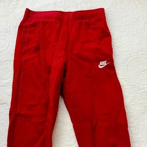 Red Nike joggers worn once